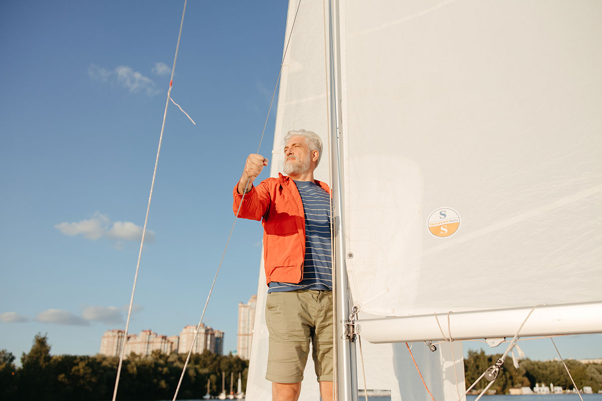 senior man sailing on the river